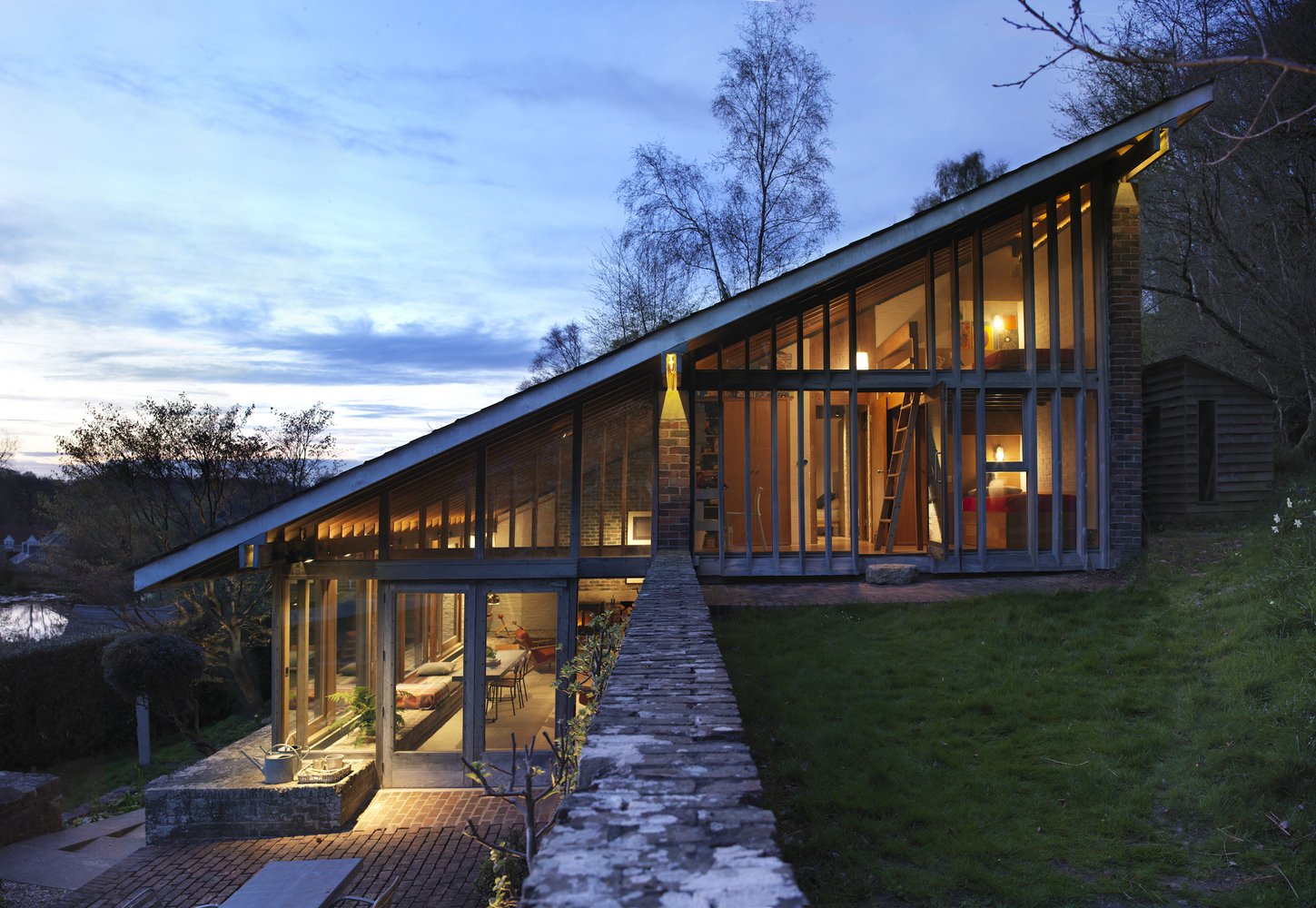 modern hillside Ansty Plum house - exterior night