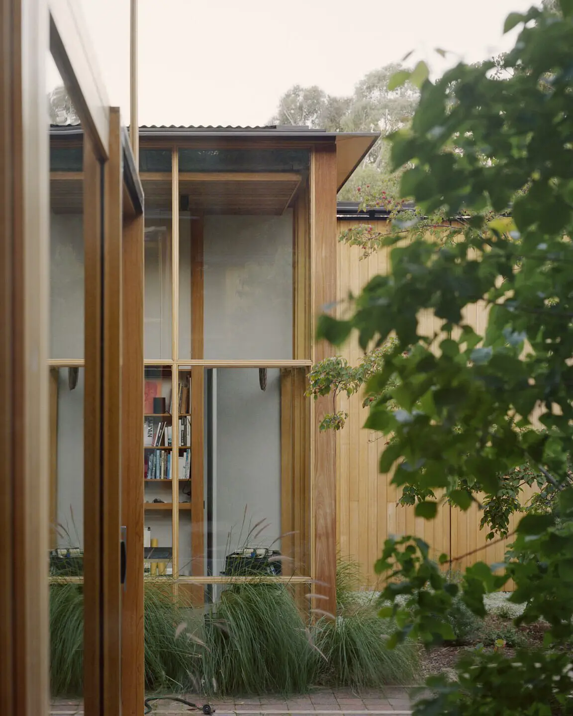 Wood-paneled courtyard house - studio view