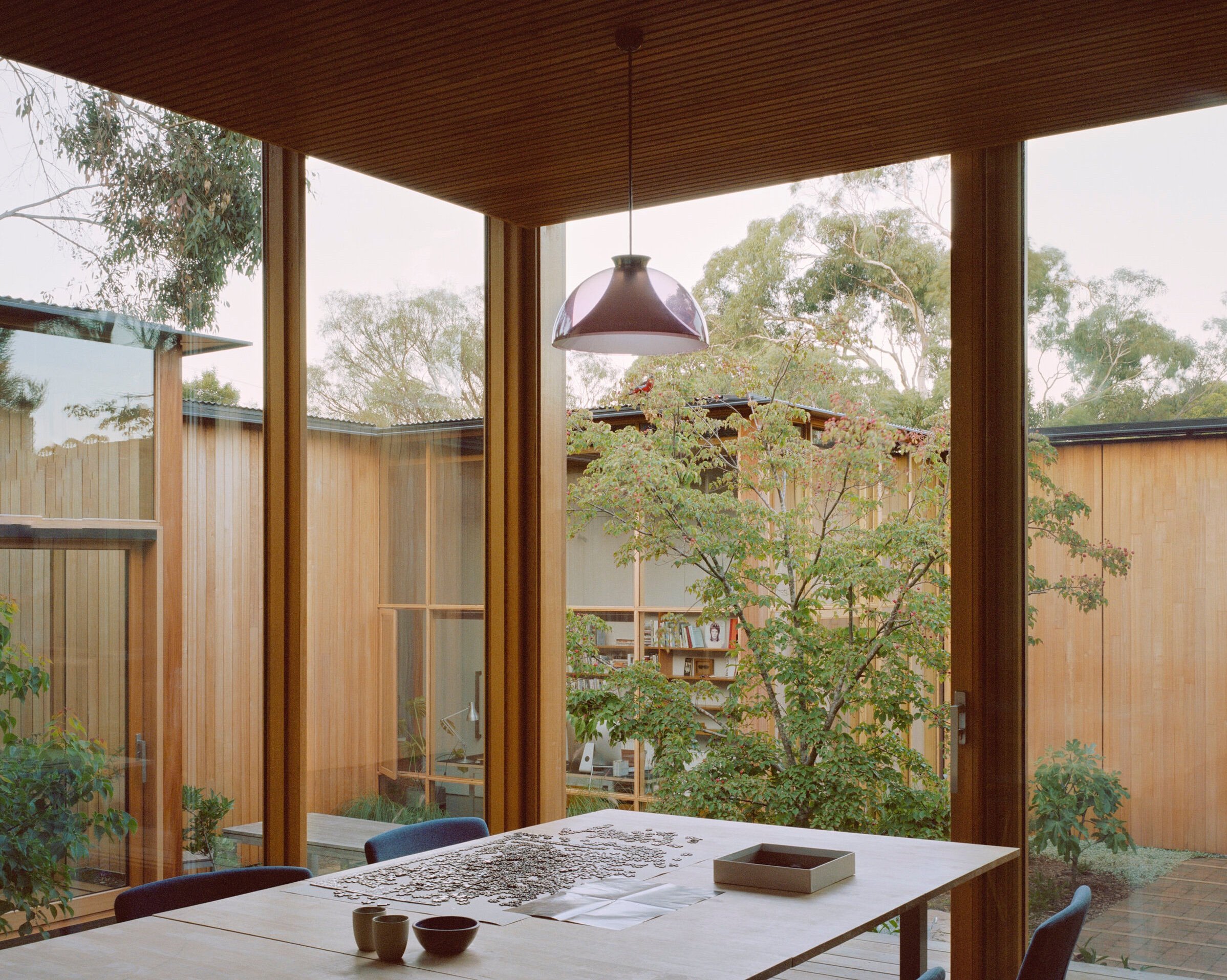 Wood-paneled courtyard house - dining room