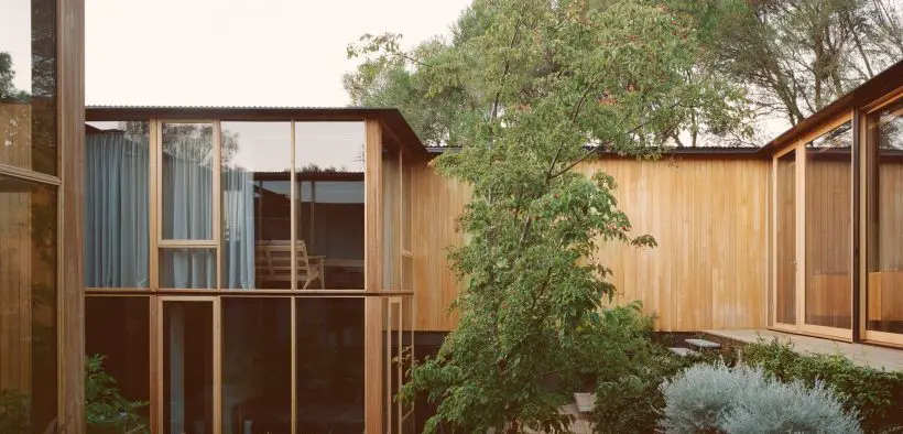 Wood-paneled courtyard house -living room view