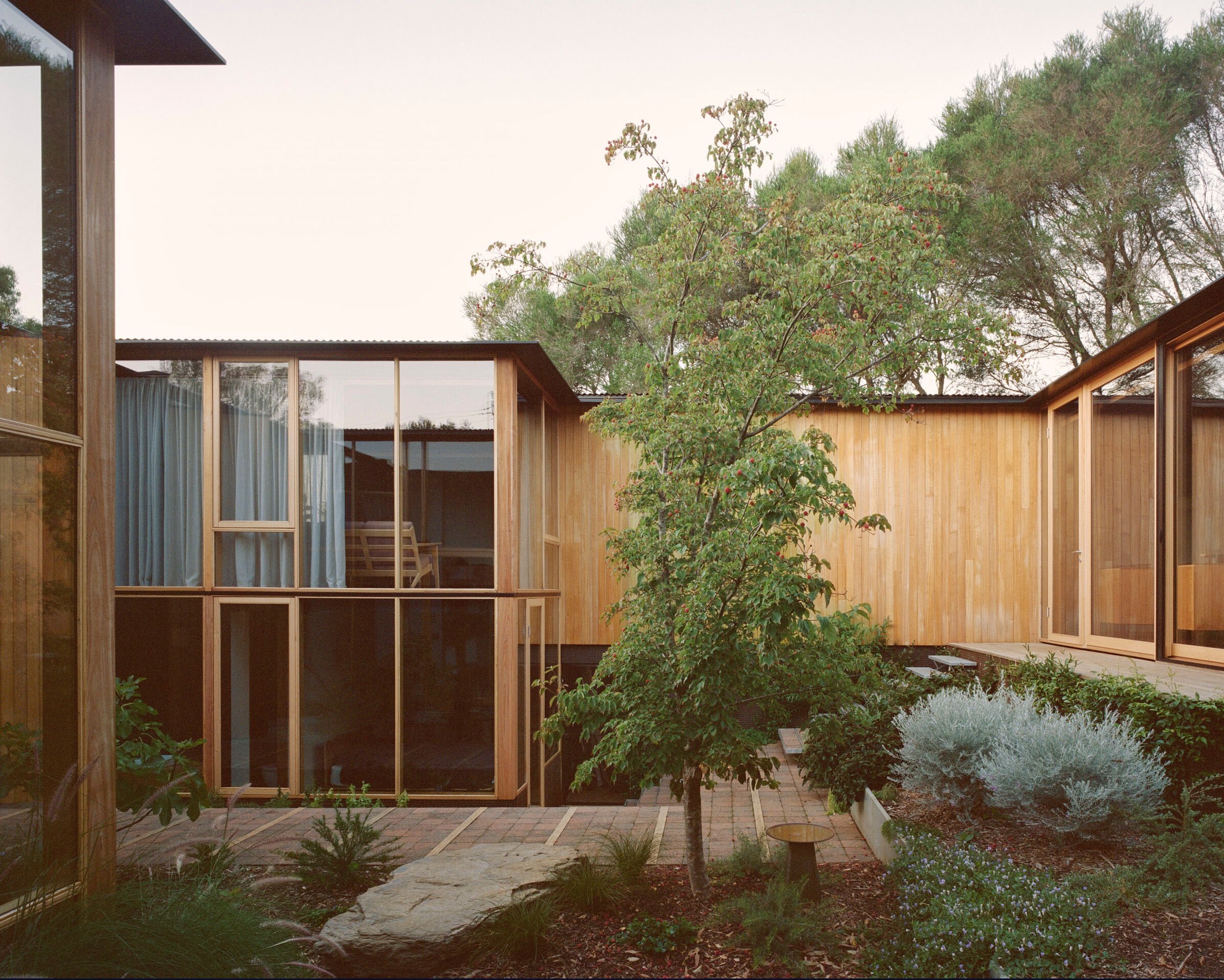 Wood-paneled courtyard house -living room view