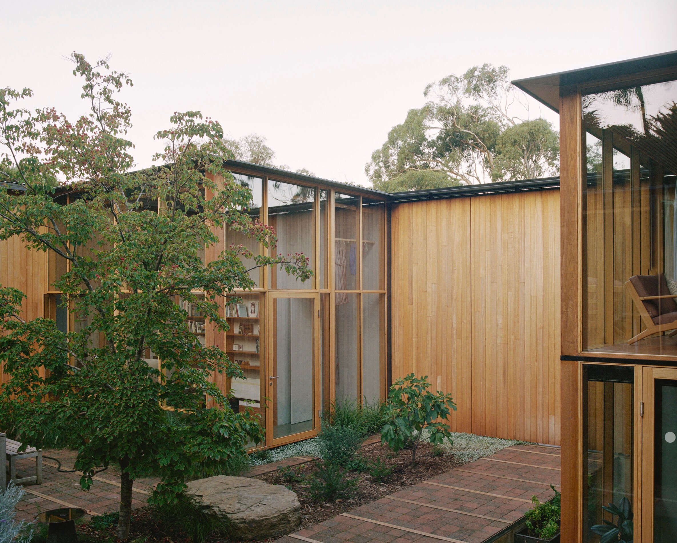 Wood-paneled courtyard house
