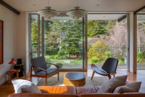 A modern house designed to showcase art and midcentury lights - living