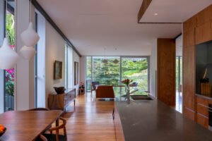 A modern house designed to showcase art and midcentury lights - living