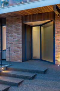 modern house designed to showcase art and midcentury lights - entrance