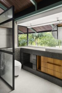 Open plan indoor-outdoor house - bathroom