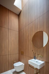 modernist glass box extension 1890 cottage - bathroom