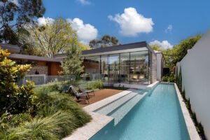 modernist glass box extension 1890 cottage - pool
